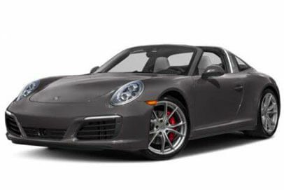 A close-up of a gray Porsche car against a white background.