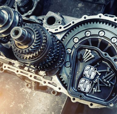 A close-up of a car Transmission gears and bolts.